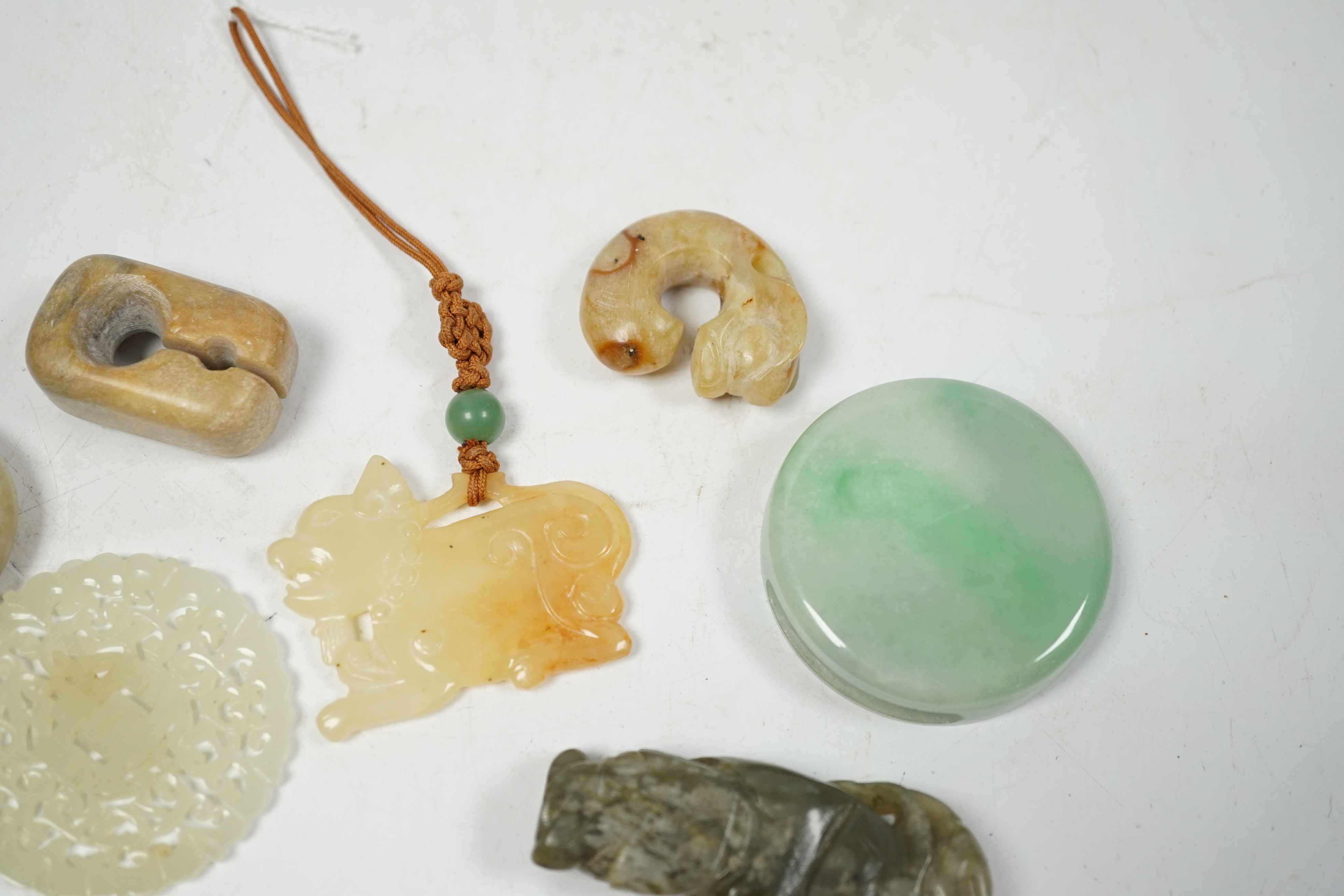 Four Chinese jade plaques or pendants, five other various jade or hardstone carvings, 19th/20th century largest 9cm wide